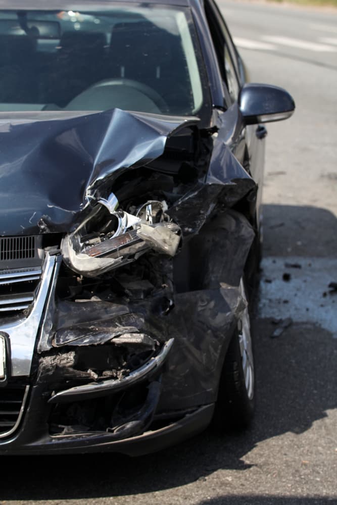Image depicting vehicles in a collision or crash, highlighting the aftermath of a car accident.