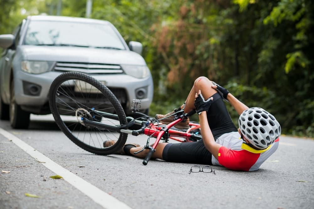 A biker was injured after being struck by a car while riding on the road. The collision resulted in significant injuries to the cyclist.