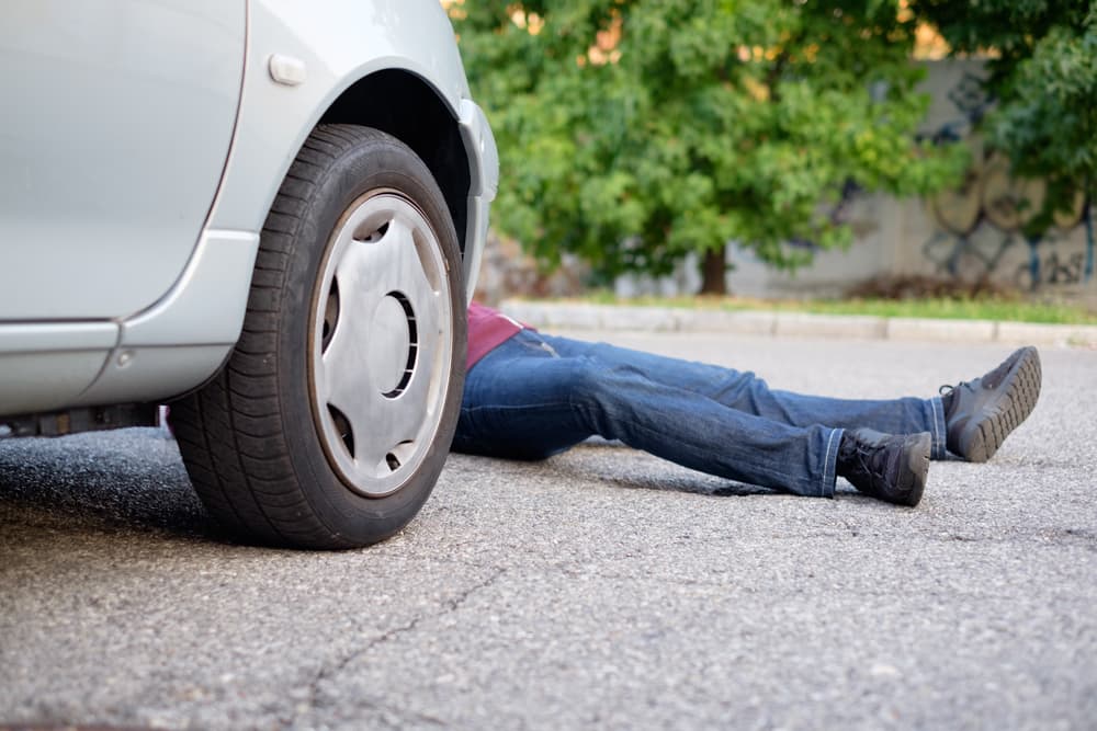 Pedestrian involved in incident following car accident.