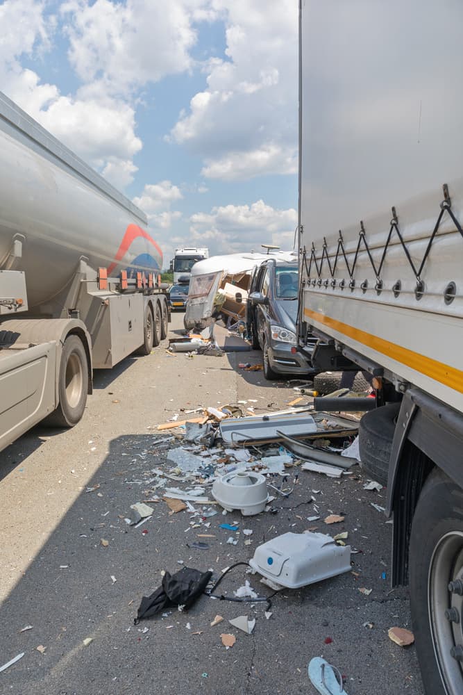 Semi-Truck and Camper Trailer Collision on the Highway.