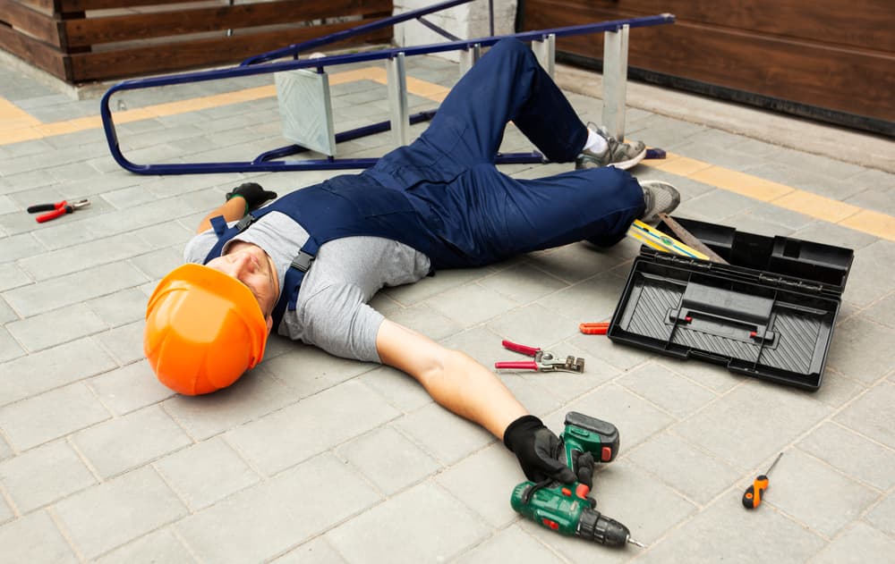 The worker fell from the ladder while working near the house.