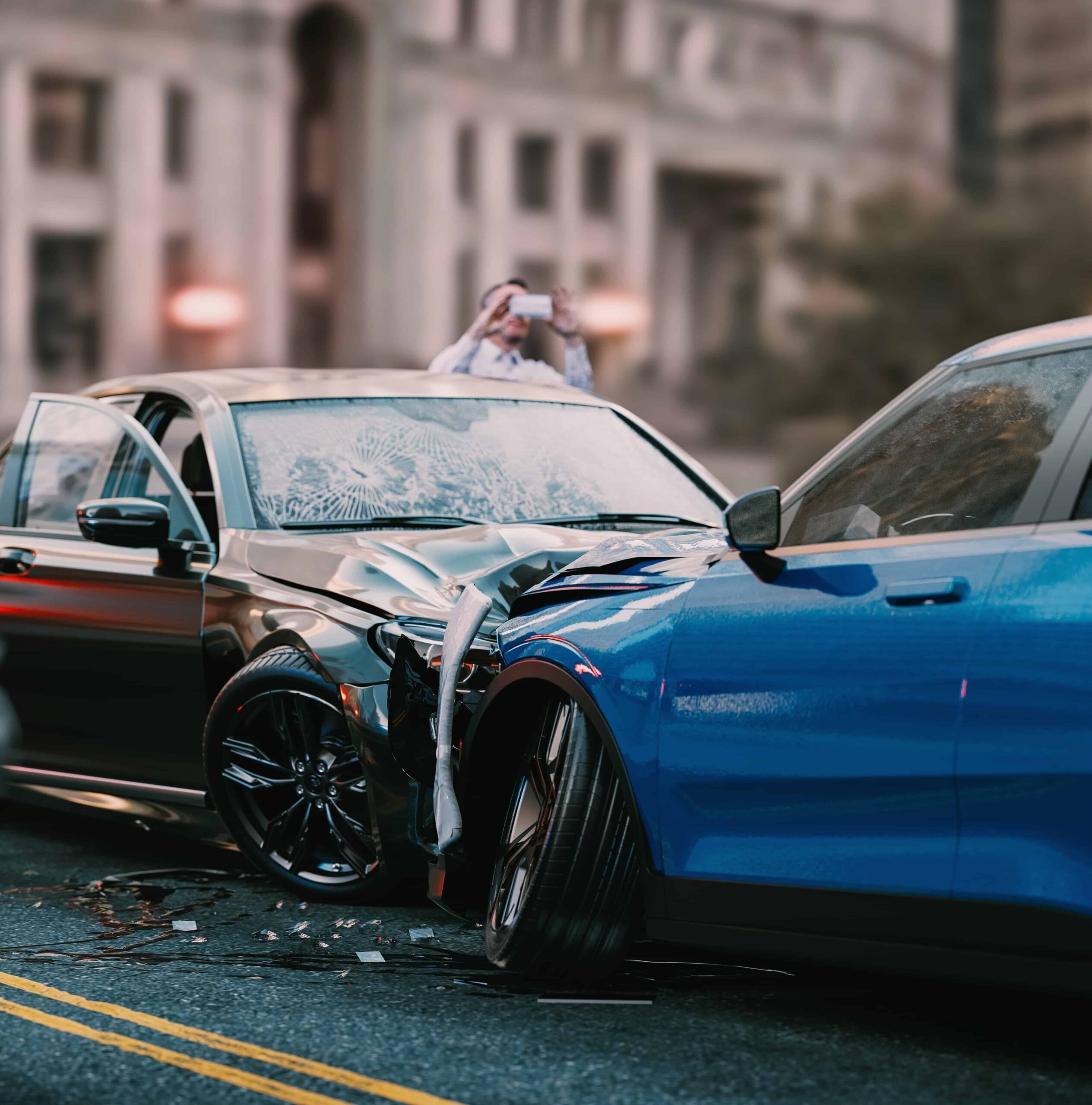Two cars involved in a severe traffic accident with front-end damage on an urban street.